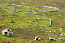 Stone cleats and circular dry-stone walls above the main settlement in Village Bay, Hirta. St Kilda, Outer Hebrides, Scotland. June.