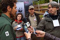 Press interviewing Magor Czibi from WWF Romania about the release of European bison / Wisent (Bison bonasus) in the Tarcu mountains nature reserve, Natura 2000 area, Southern Carpathians, Romania. May...