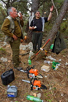 Members of the Lagosta hunting club taking a break during work on Dolin island, Velebit Mountains Nature Park, Croatia, April 2014.