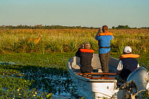 Tourists on boat for wildlife watching trip, Ibera Marshes, Corrientes Province, Argentina