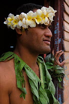 Man wearing traditional floral headdress and leaves for ceremony, Kioa Island, Fiji, South Pacific, July 2014.