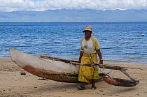 Fisherman with outrigger fishing canoe. Kioa Island, Fiji, South Pacific, July 2014.