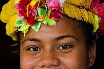 Woman wearing traditional floral headdress for ceremony, Kioa Island, Fiji, South Pacific, July 2014.