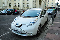 Nissan electric car at charging point, Brighton, UK, March 2014.