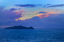 Inishtooskert also known as the Sleeping Giant / An Fear Marbh as seen from the Dingle Peninsula at dusk, County Kerry, Republic of Ireland. Inishtooskert holds important seabird colonies and extensiv...