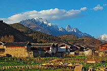Landscape of village and mountains from near Lashihai lake, Lijiang City, Yunnan Province, China. January 2012