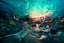 Ice cave with melt water running through, Mendenhall Glacier, Juneau, Alaska, USA, August 2014.