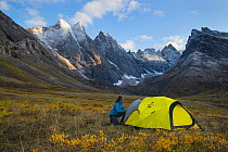 Camper below the Arrigetch Peak, Brooks Range, Gates of the Arctic National Park, Alaska, USA, August. Model released