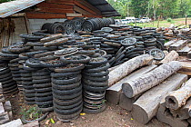 Siam rosewood tree (Dalbergia cochinchinensis) timber and motorcycle wheels, used by poachers to make carts for removing timber, stored as evidence, Thap Lan National Park, Dong Phayayen-Khao Yai Fore...