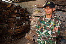 Pang Sida ranger Wisak Thongseekram at evidence store containing Siam rosewood tree (Dalbergia cochinchinensis) confiscated from poachers, Pang Sida National Park, Dong Phayayen-Khao Yai Forest Comple...