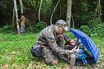 Eric Ash of Freeland Foundation examining camera trap images, Dong Phayayen-Khao Yai Forest Complex, eastern Thailand, August, 2014.