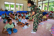 Pang Sida national park community outreach volunteer Radabha 'Huang' Prapapornpipat, teaching children at Baan Klong Pla Do school, eastern Thailand, August, 2014.