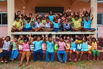 Pang Sida national park community outreach volunteer Radabha 'Huang' Prapapornpipat (left, back row) with children at Baan Klong Pla Do school, eastern Thailand, August, 2014.
