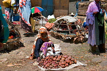 Woman selling locally grown vegetables in Addis Mercato,Addis Ababa, Ethiopia. February 2009
