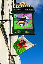 Sign for The Bee Hotel, with drawing of Bumblebee (Bombus) and Welsh flag below, Abergele, Denbighshire, Wales, UK. August 2014.