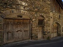 Stone building with wooden doors, typical of the area. Queyras, Hautes-Alpes, France, October 2014.