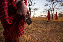 Mobile phone in  hand of Maasai man, Mara region, Kenya, September 2013.