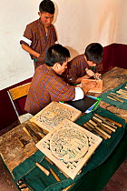 Woodcarving class at the National Institute For Zorig Chusm (School Of The Arts) in Thimphu. Bhutan, October 2014.