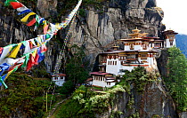 The Tiger's Nest Monastery rocky mountainside with prayer flags,  near the town of Paro. Bhutan, October 2014.