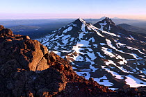 View north at sunrise from the summit of South Sister, Three Sisters Wilderness, Deschutes National Forest. The Large mountains, distance are Middle Sister, North Sister, Mount Jefferson, Mount Hood a...