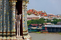Detail of Wat Arun with the Mae Nam Cho Phraya River and Bangkok, background. Thailand, September 2014.