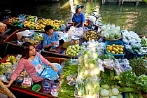 Boats loaded with fruit and vegetables to sell at the Ladmayom Floating Market near Bangkok, Thailand, September 2014.