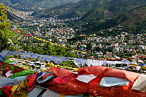 Prayer flags on hill above the city of  Thimphu. Bhutan, October 2014.