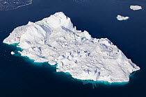 Aerial view of an iceberg in the Ilulissat Icefjord, where the Sermeq Kujalleq Glacier or Jakobshavn Isbrae enters the sea, near Ilulissat, UNESCO World Heritage Site, Kalaallit Nunaat, Greenland. Aug...