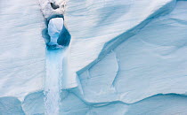 Austfonna glacier melting to form waterfall, Nordaustlandet, Svalbard, Norway, August.