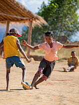 Girls and boys playing football, Anjaha Community Conservation Site, near Ambalvao, Madagascar. November 2014.