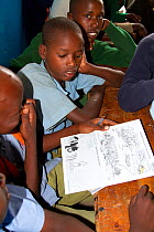 Save the Elephants mobile eduction unit teaching children about living together with elephants and how to protect them. GirGir Primary School, near Samburu National Reserve, Kenya.
