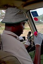 Dr. Rono Bernard getting ready to dart an elephant using M99 tranquilizer. Samburu National Reserve, Kenya. Model Released. Taken with cooperation of Kenya Wildlife Service and Save the Elephants