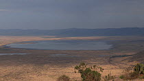 Panning shot of Ngorongoro Crater from the crater rim, Tanzania.