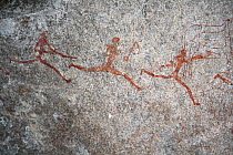 San rock painting of running men, Matobo Hills, Zimbabwe. January 2011.