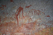 San rock painting of human figures and antelopes, Matobo Hills, Zimbabwe. January 2011.