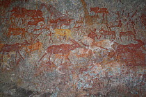 San rock paintings of humans figures and antelopes, Matobo Hills, Zimbabwe. January 2011.
