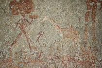 San rock painting of human figures and giraffe, Matobo Hills, Zimbabwe. January 2011.