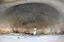 San rock paintings with man for size comparison, Matobo Hills, Zimbabwe. January 2011.