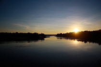Zambezi River, during rainy season at sunset, Sioma Nqwezi Park, Zambia. November 2010.