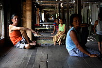 Dayak people in longhouse, Pontianka, West Kalimantan, Indonesian Borneo. June 2010.