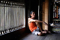 Dayak people in longhouse, Pontianka, West Kalimantan, Indonesian Borneo. June 2010.