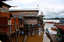Singkawang, houses in the Kapuas river, West Kalimantan, Indonesia Borneo. June 2010.