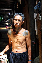 Dayak man with traditional tatoos, West Kalimantan, Indonesian Borneo. June 2010.