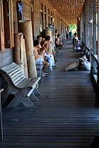 People in Dayak longhouse, West Kalimantan, Indoneisan Borneo. June 2010.