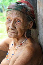 Elderly Dayak woman with stretched ear lobes, Central Kalimantan,  Indonesian Borneo. June 2010.