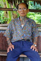 Dayak headhunter with traditional tattoos, Dayak, Central Kalimantan,  Indonesian Borneo. June 2010.