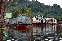 Floating Dayak longhouse outside of river, Gunung Palung National Park, West Kalimantan, Indonesian Borneo. July 2010.