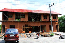 Timber built house under construction, Balipapan, East Kalimantan, Borneo. June 2010.