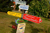Local business signs in Rieth village, Stettiner Haff, Oder delta, Germany, August.