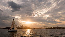 Luxury yacht sailing at dusk in the Sydney Harbour, New South Wales, Australia, October 2012. All non-editorial uses must be cleared individually.